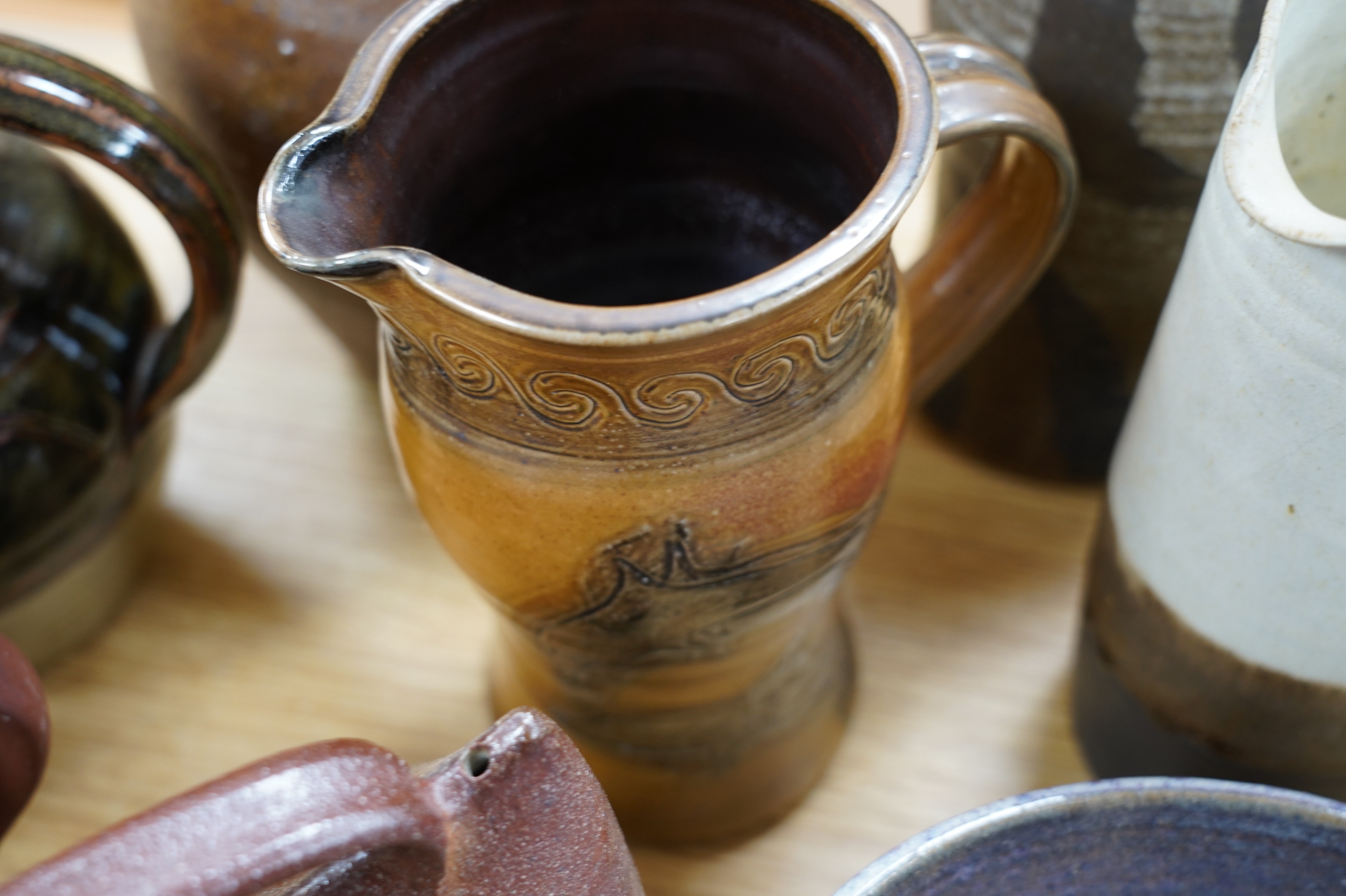 Nine studio pottery jugs, a vase and a bowl, etc. (11)